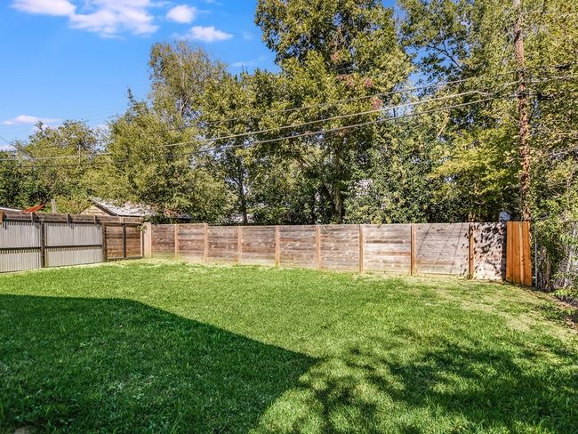 View of fenced backyard | Image 30