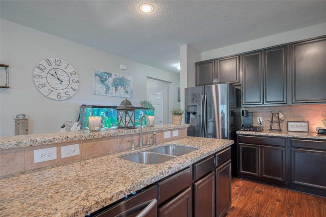 This beautiful stainless steel refrigerator stays with the home | Image 19