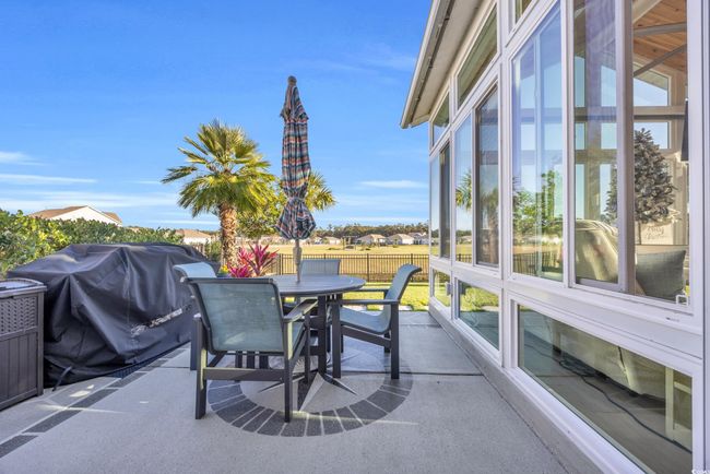 View of patio featuring outdoor dining area and a grill | Image 28