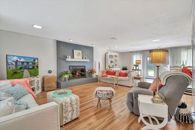 Another view of the spacious family room. This home has been loved and used for so many family and friend gatherings, especially Christmas and holiday time welcoming Christmas caroling, story telling and family movie and game nights. | Image 10