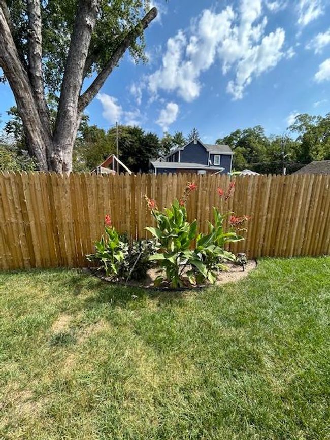 View of yard featuring garden and fence | Image 31
