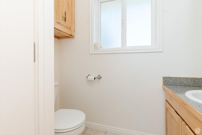 Bathroom featuring toilet and vanity | Image 43
