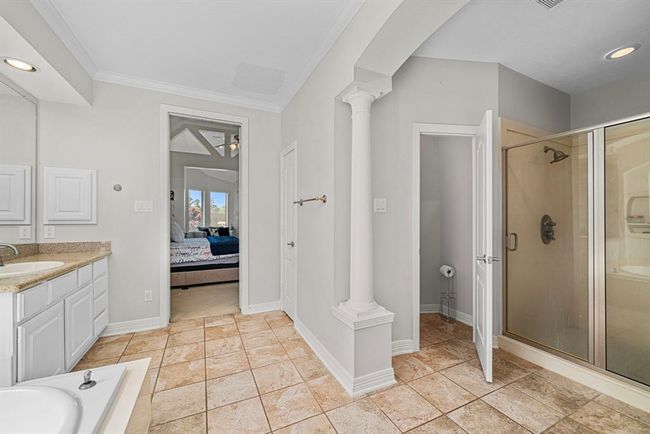 Luxury designed Primary Bathroom equipped inviting walk-in shower | Image 20