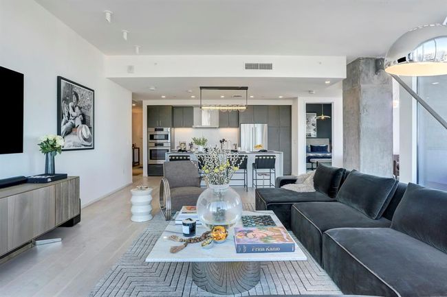 Living area featuring light wood-style floors | Image 8
