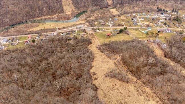 Looking down the right of way, property goes past the right strip of trees to the right behind the house below. | Image 5
