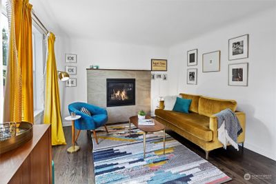 Beautiful hardwood floors, gas fireplace, lots of natural light make this an inviting space to hang out. | Image 2