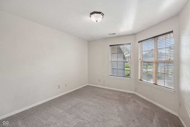 unfurnished room with carpet flooring and baseboards | Image 17
