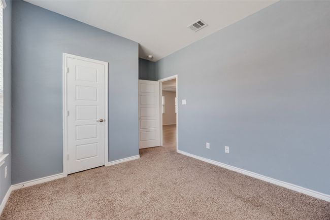 Unfurnished bedroom featuring carpet and baseboards | Image 30