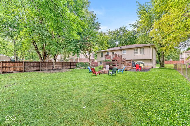 fenced backyard with an outdoor fire pit | Image 29
