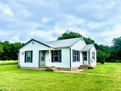 View of front of house featuring a front lawn | Image 1