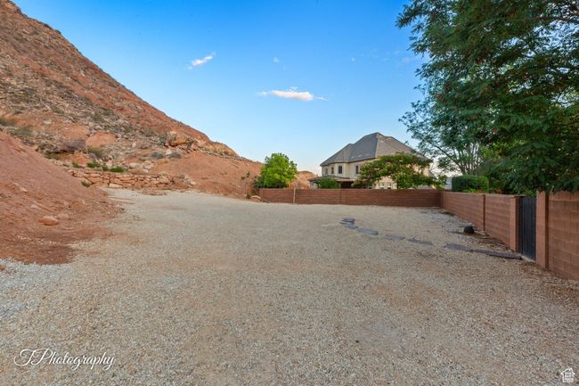 View of fenced backyard | Image 64