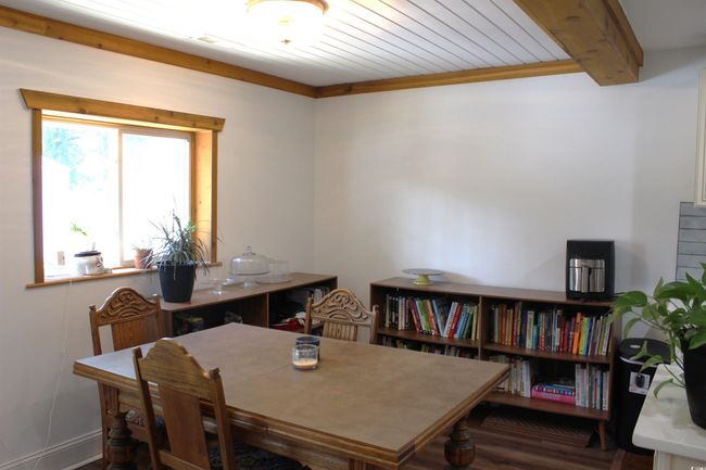 Dining room featuring wood finished floors and wooden ceiling | Image 16