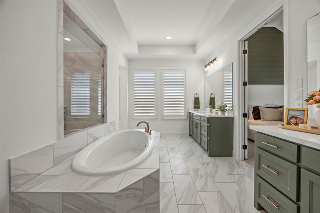 Bathroom featuring vanity, a bath, a shower stall, recessed lighting, and a tray ceiling | Image 26