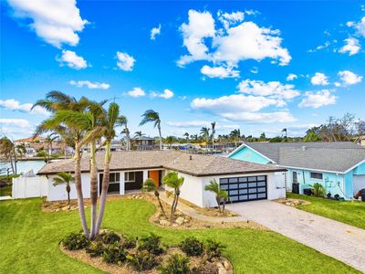 This beautiful home is 2nd from the end of a finger on Boca Ciega Bay and is just north of the Madeira Beach Causeway shown in the background!! | Image 2