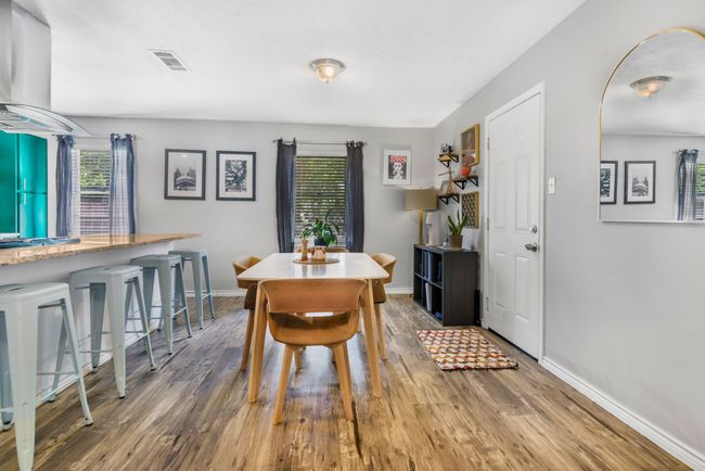 Dining room featuring healthy amount of natural light, wood finished floors, and baseboards | Image 8