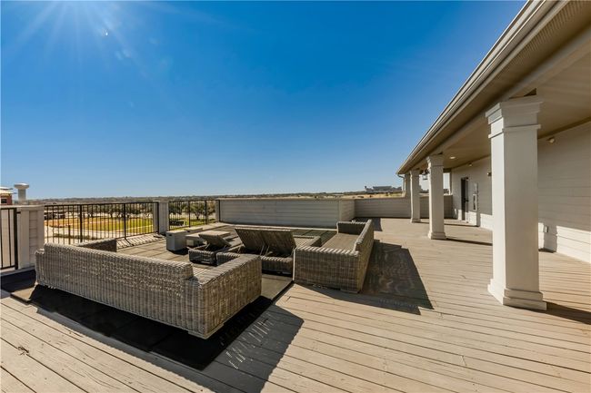 Wooden terrace with an outdoor hangout area | Image 33