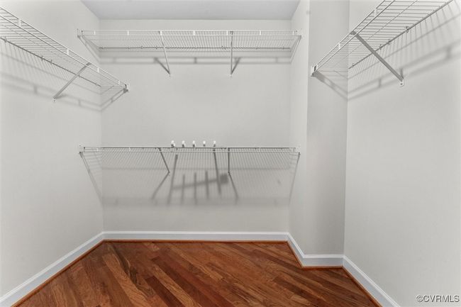 Walk in closet with wood finished floors | Image 25
