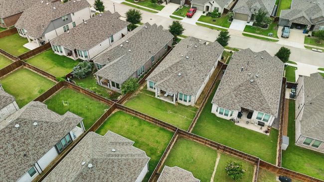 Aerial view of property's location featuring nearby suburban area | Image 25