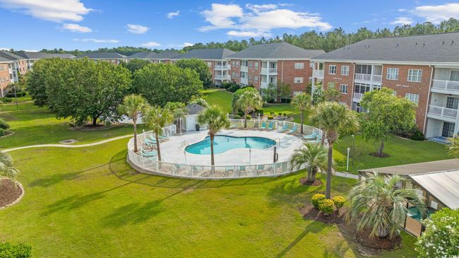Community pool featuring a residential view and a patio | Image 24