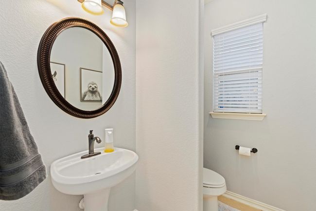 Half bathroom featuring a sink and toilet | Image 22