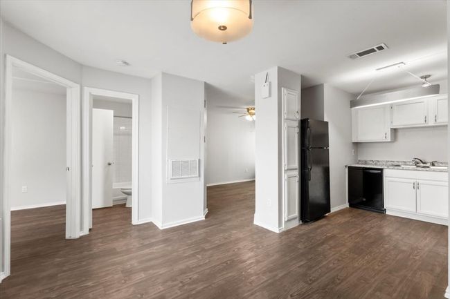 Easy access to guest bath and kitchen from dining area | Image 12