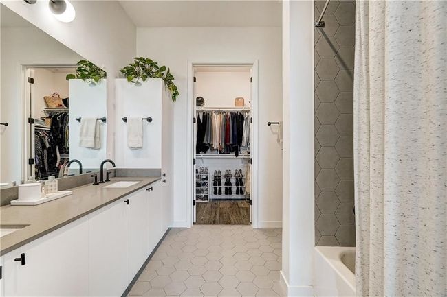 Primary bathroom offers double sinks, lots of counterspace and a nicely sized linen closet | Image 17