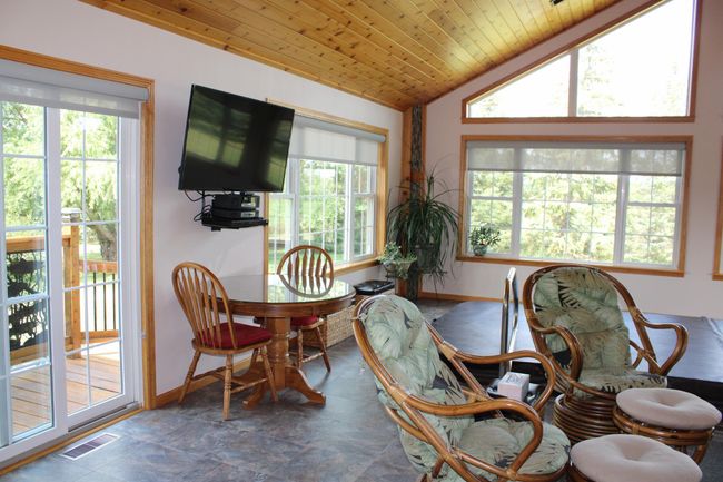 Looking from the kitchen to the sunroom amazing views. | Image 25