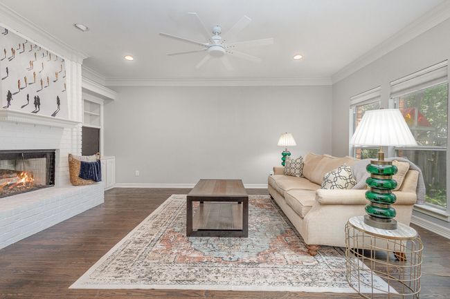 Spacious den with hardwood flooring | Image 13