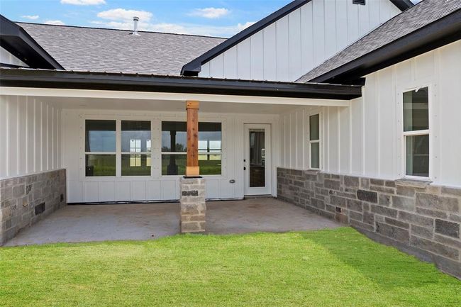 Expansive back patio perfect for outdoor entertaining and relaxation. | Image 46
