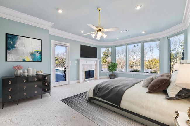 Primary Bedroom with breathtaking view of the golden pond and easy access to the pool. Virtually Staged | Image 21