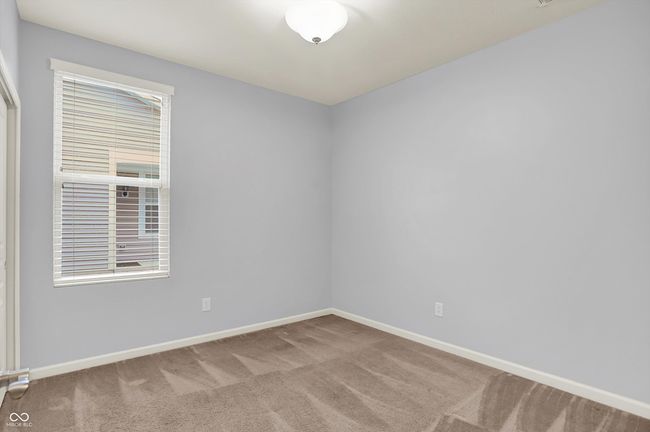 carpeted spare room featuring healthy amount of natural light | Image 14