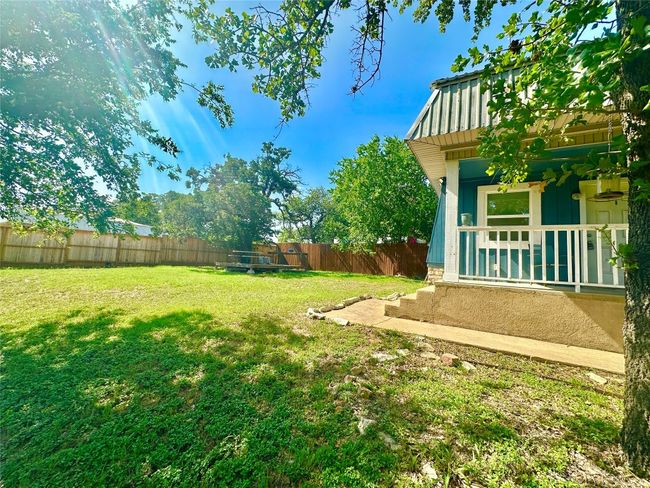 View of fenced backyard | Image 37