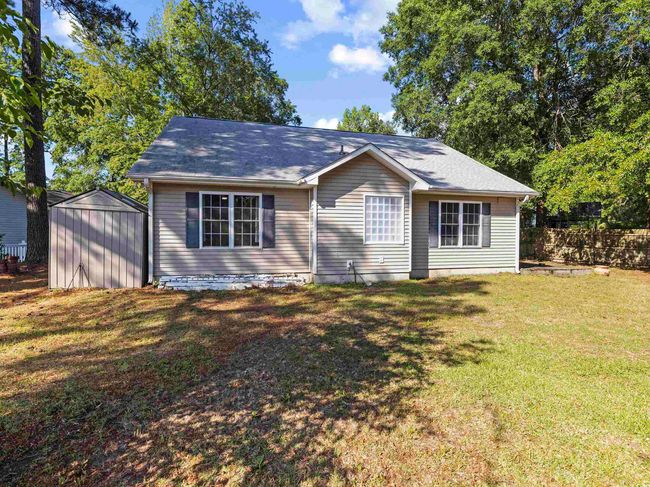 View of front of home with a storage shed, an outbuilding, and a front lawn | Image 28
