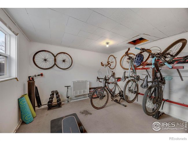 Storage room off of the garage. This could be an office or workout room. | Image 32