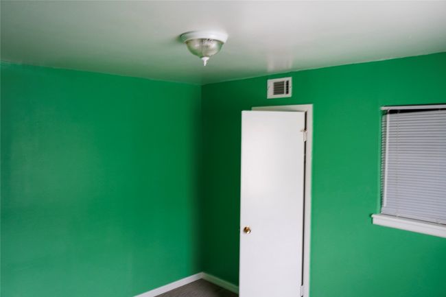 Empty room featuring baseboards and visible vents | Image 13