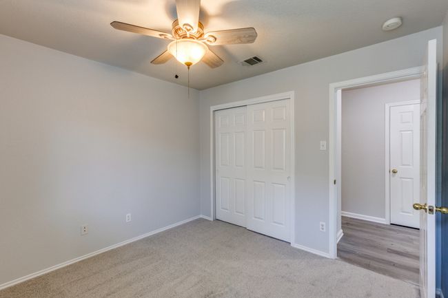 Bedroom #1 Unfurnished bedroom featuring light carpet, a closet, and ceiling fan | Image 21