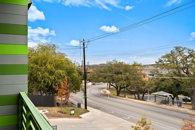 View of asphalt road featuring sidewalks and curbs | Image 17