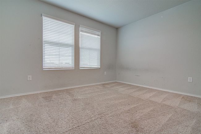 Spare room with light colored carpet and baseboards | Image 23