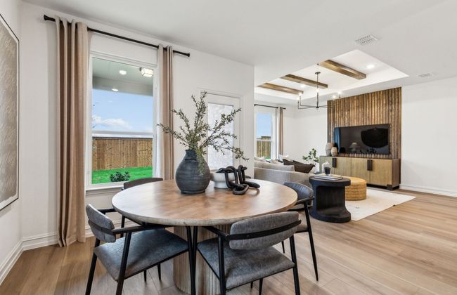 Airy dining room*Photos of furnished model. Not actual home. Representative of floor plan. Some options and features may vary | Image 8