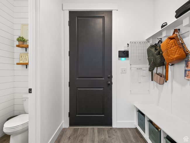 Mudroom featuring dark wood-style flooring and baseboards | Image 14