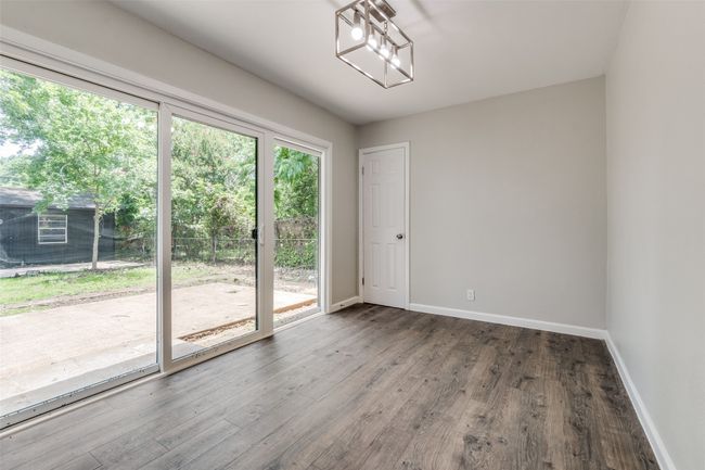 Empty room featuring baseboards and wood finished floors | Image 15