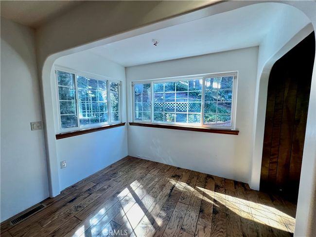 Dining area open to living room. | Image 16
