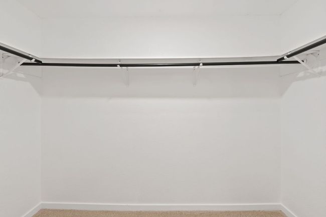 Walk in closet featuring carpet flooring | Image 19