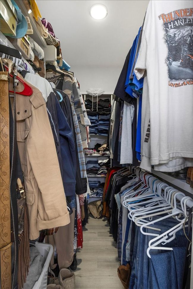 Spacious closet featuring wood finished floors | Image 22
