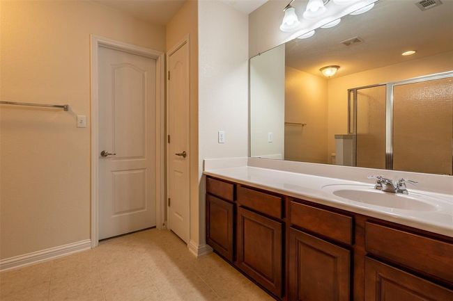 Bathroom featuring vanity and a shower stall | Image 16
