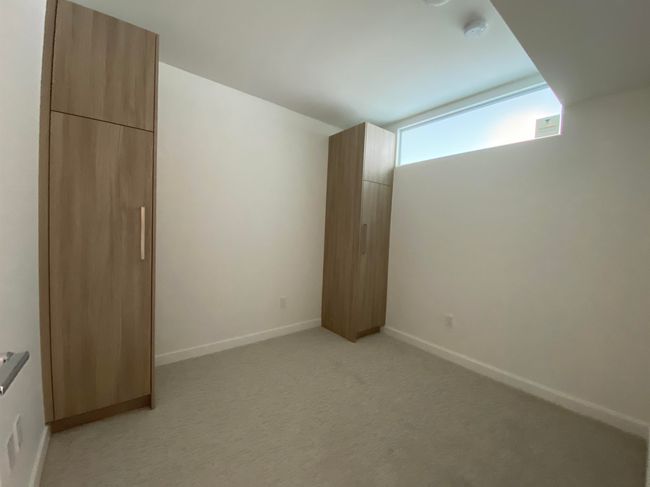 Interior space with baseboards and light carpet | Image 5