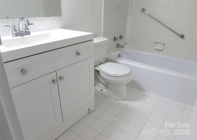 View of bathroom showing white tile floor | Image 20