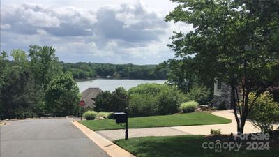 Street view towards lake for 4012 Beechwood Spring Ln Belmont NC | Image 1