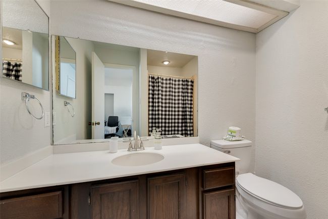 Bathroom featuring vanity and toilet | Image 16