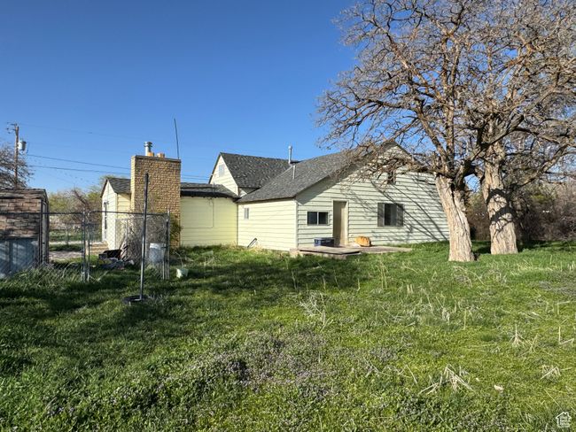 Back of house with a shingled roof | Image 25